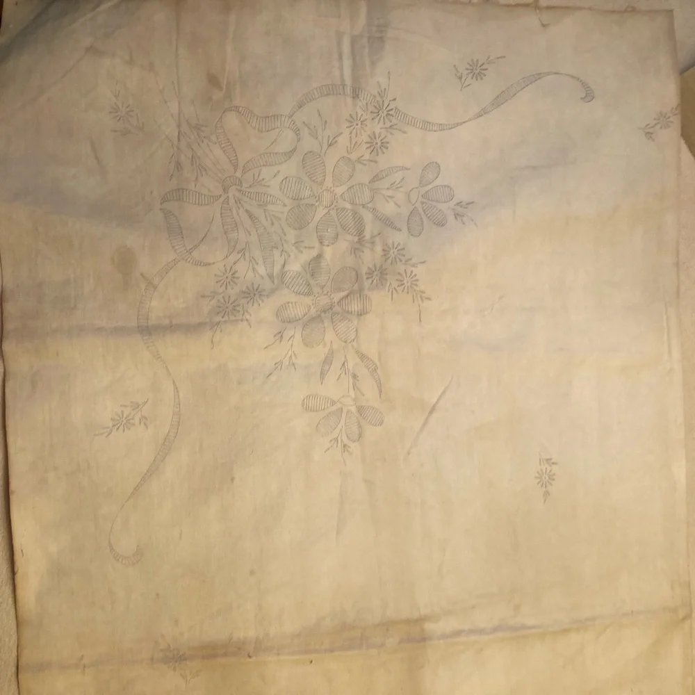 Vintage embroidery muslin, three corners begun, one ink outline blue pink red